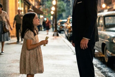 As the mafia boss exited his car, a small trembling hand brushed his—no weapon, no danger—just a crumpled five-dollar bill. A frightened little girl stared up at him like he was her last hope, turning a routine moment into something unforgettable.